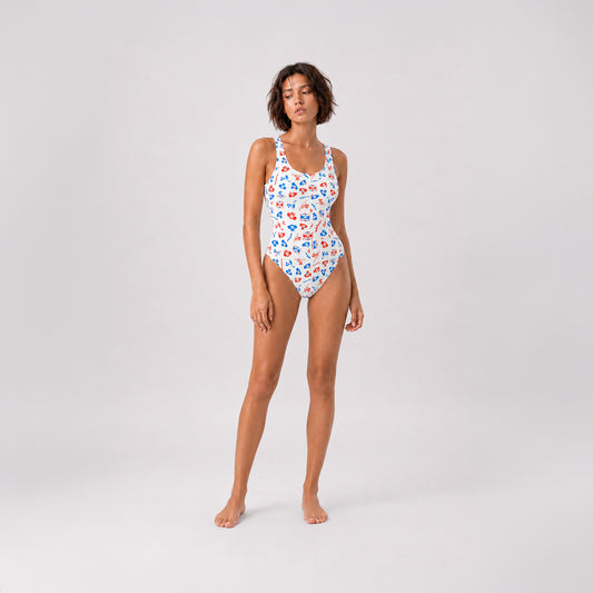 Sexy fit young model girl wearing Cheburashka pattern one-piece swimsuit.
