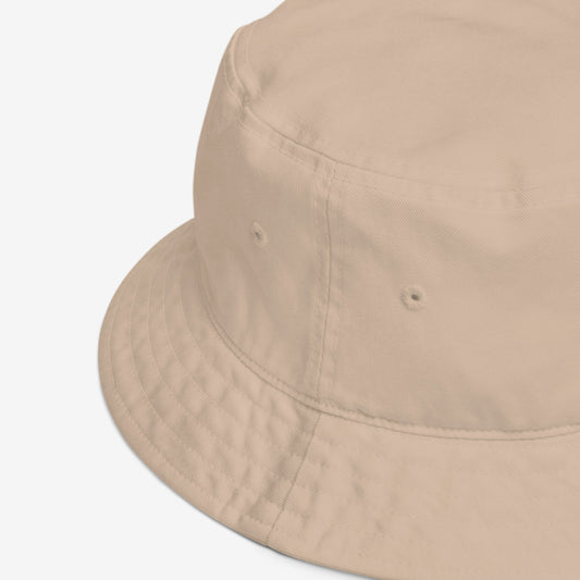 A beige bucket hat featuring original Soviet cartoon character Cheburashka. Front. Details.