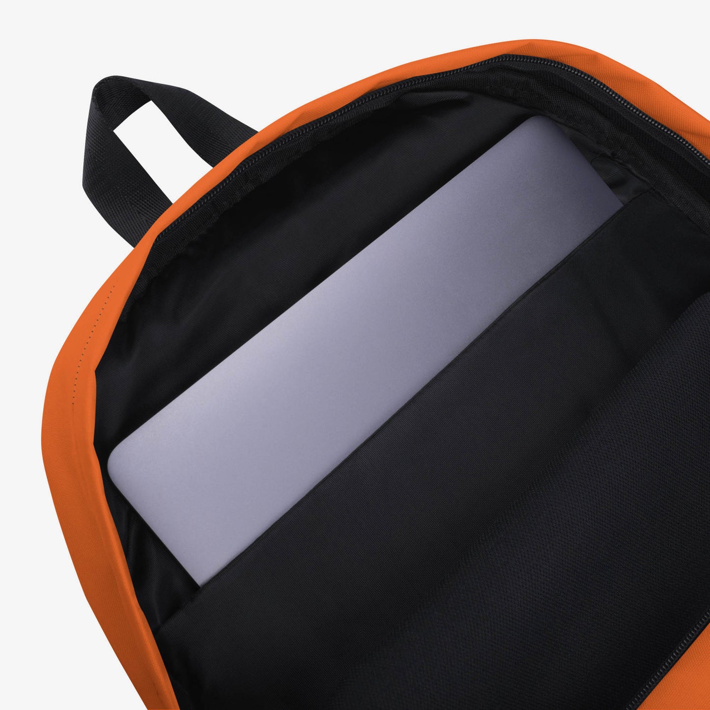 An orange backpack with a front pocket, featuring the Soviet cartoon character Cheburashka and logo 'Чебурашка' in white and yellow with flowers. Inside laptop pocket with a macbook in it.