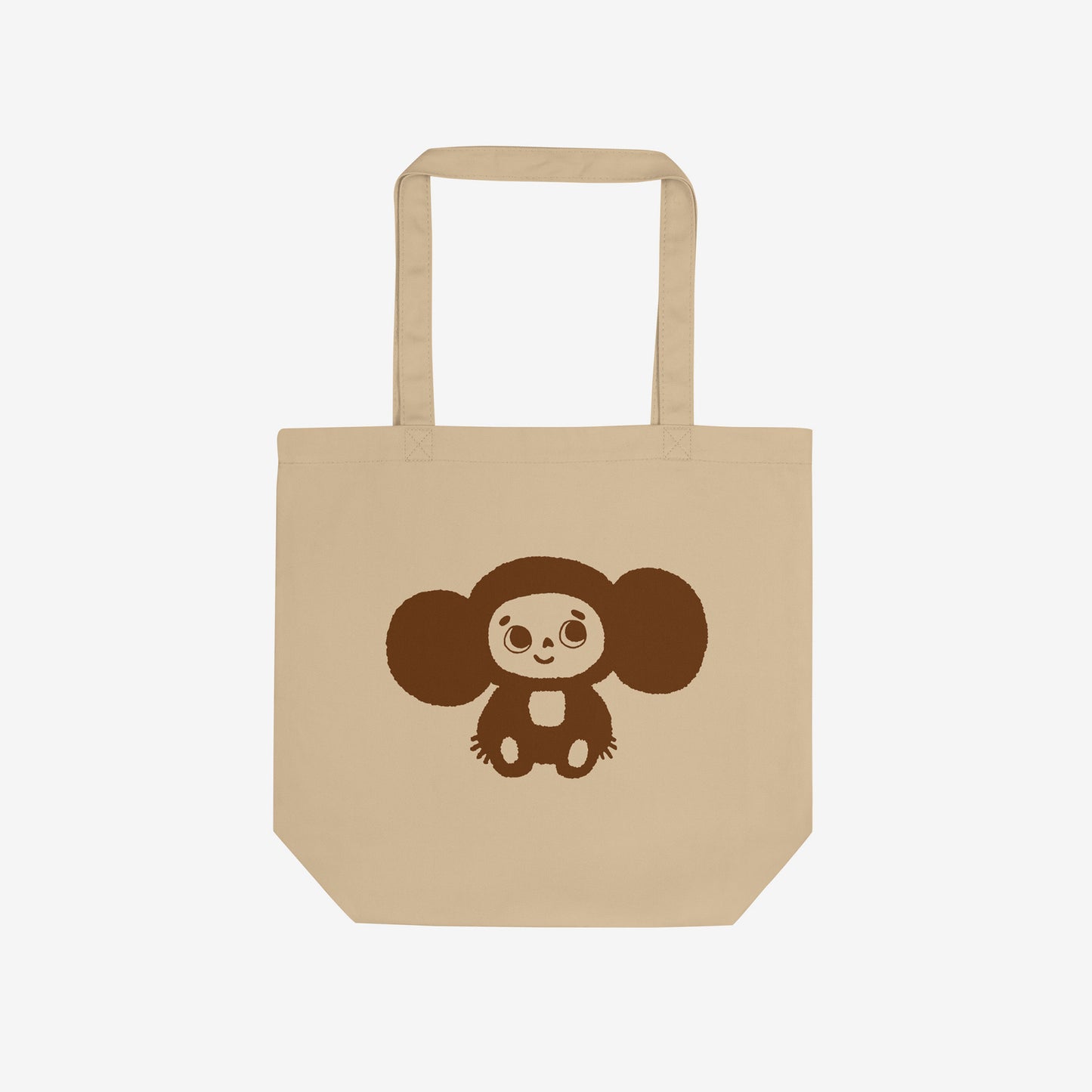 Eco tote bag with original Soviet cartoon character smiley minimalist Cheburashka on one side and Чебурашка logo on the other side. Front.