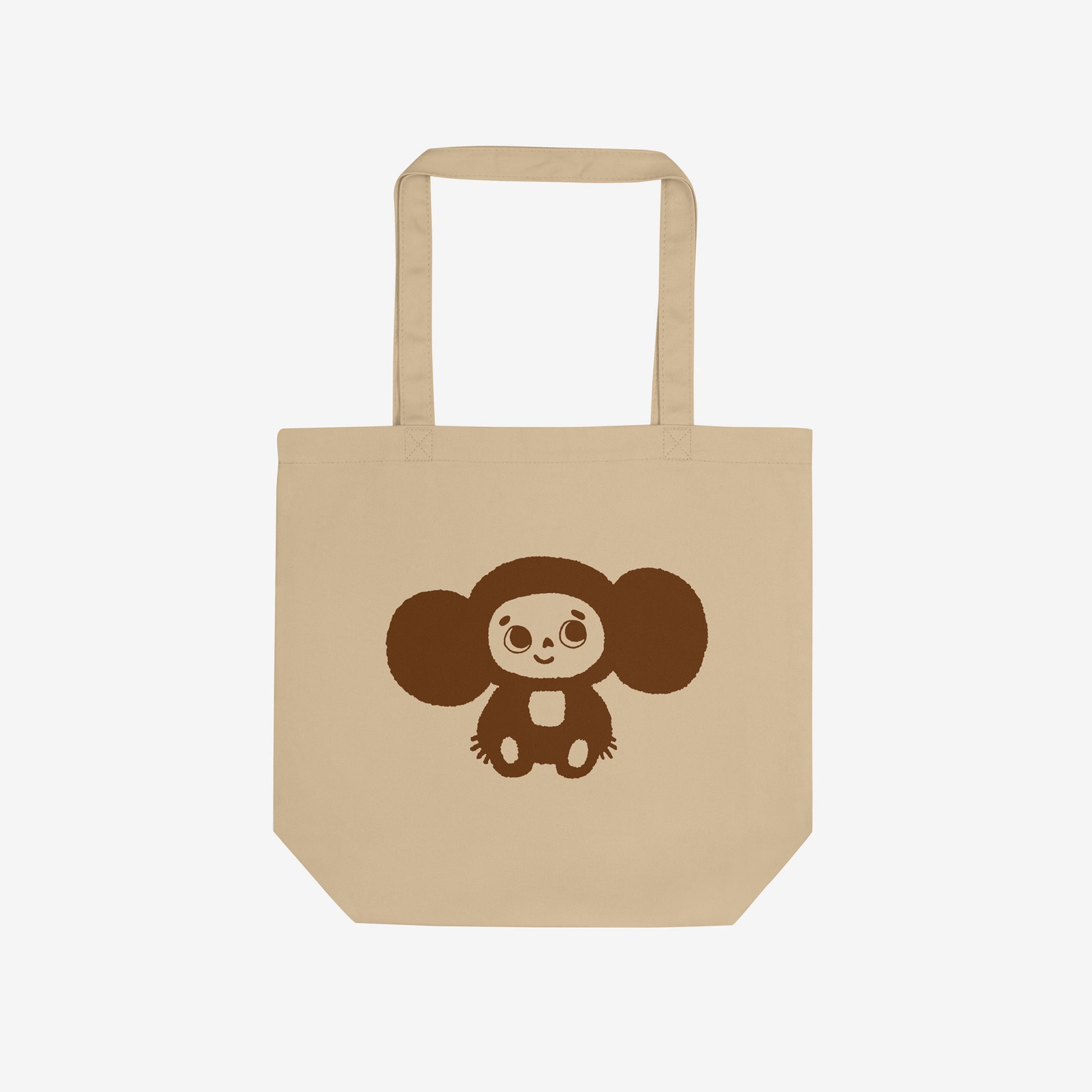 Eco tote bag with original Soviet cartoon character smiley minimalist Cheburashka on one side and Чебурашка logo on the other side. Front.