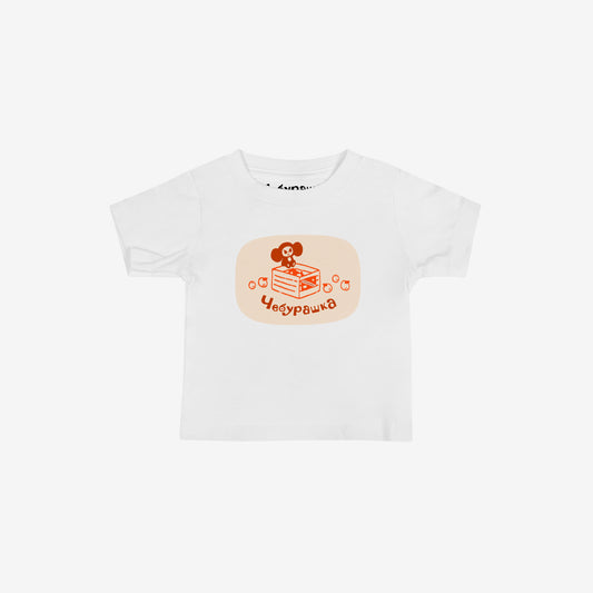 Unisex white baby Tee featuring Cheburashka sitting ona a box of oranges  and Чебурашка logo in brown. High-quality 100% cotton. 