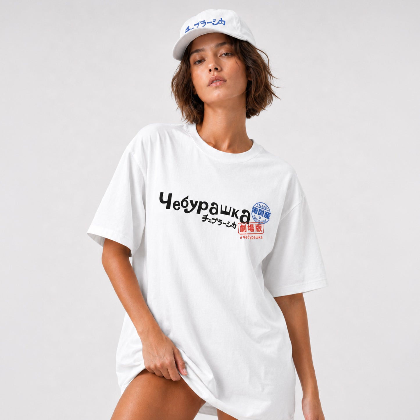 Cute model girl wearing original white unisex tee with Cheburashka logo in russian Чебурашка combined with mini logo in japanese チェブラーシカ with postal stamps.