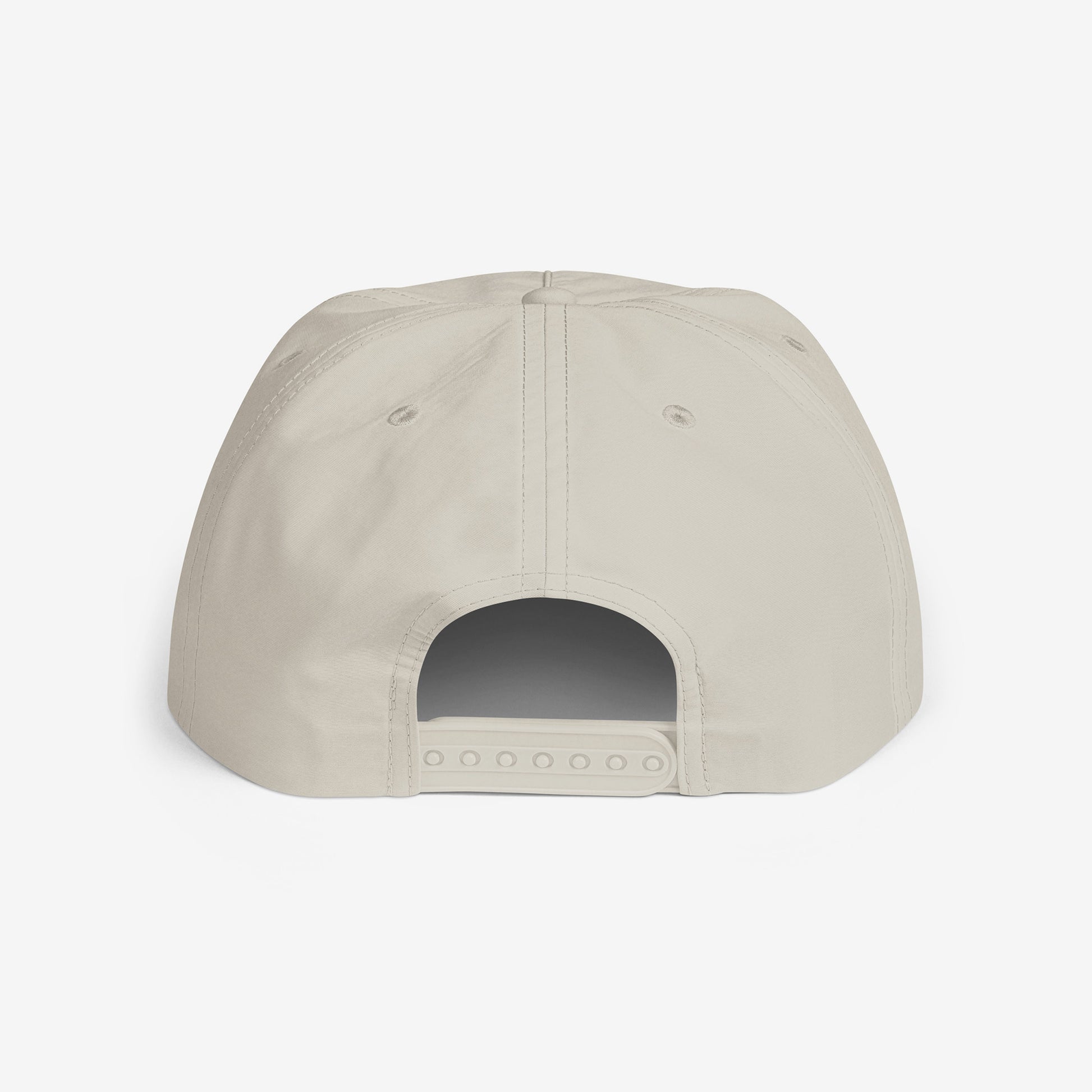 A light beige surf cap with a flat brim, featuring Cheburashka Soviet cartoon logo in japanese チェブラーシカ on the front. Back side.