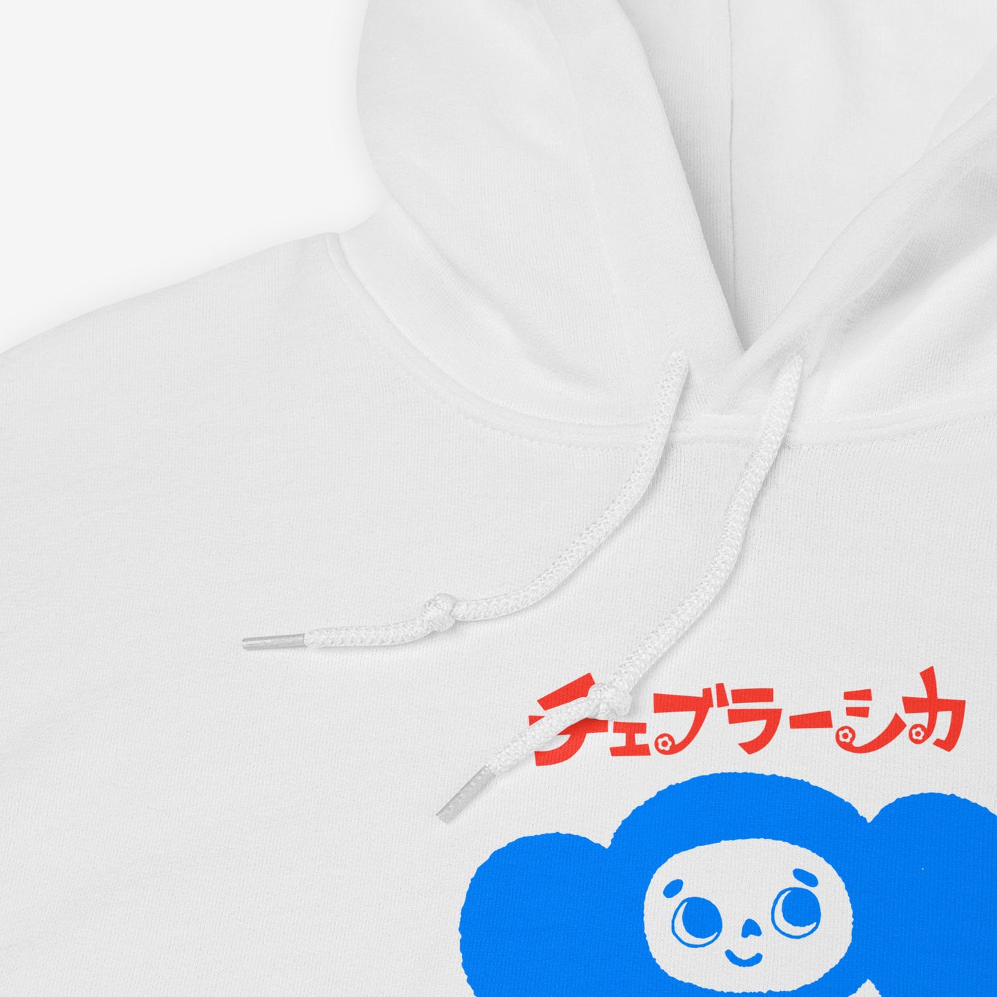 White unisex hoodie with minimalist graphic of Cheburashka with a birthday cake and チェブラーシカ japanese logo in red. Front closeup print details.