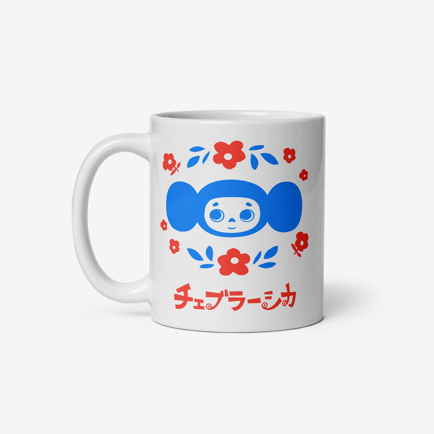 White coffee cup with Cheburashka among a pattern of flowers and チェブラーシカ logo. Front.