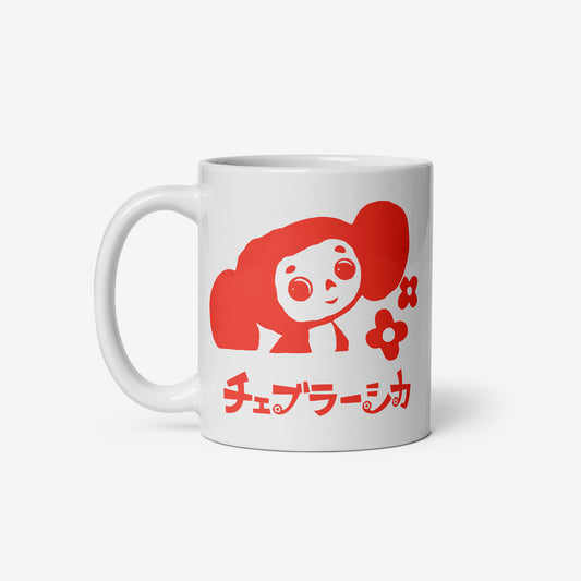 White coffee cup featuring Cheburashka with flowers and チェブラーシカ logo in red. Front.