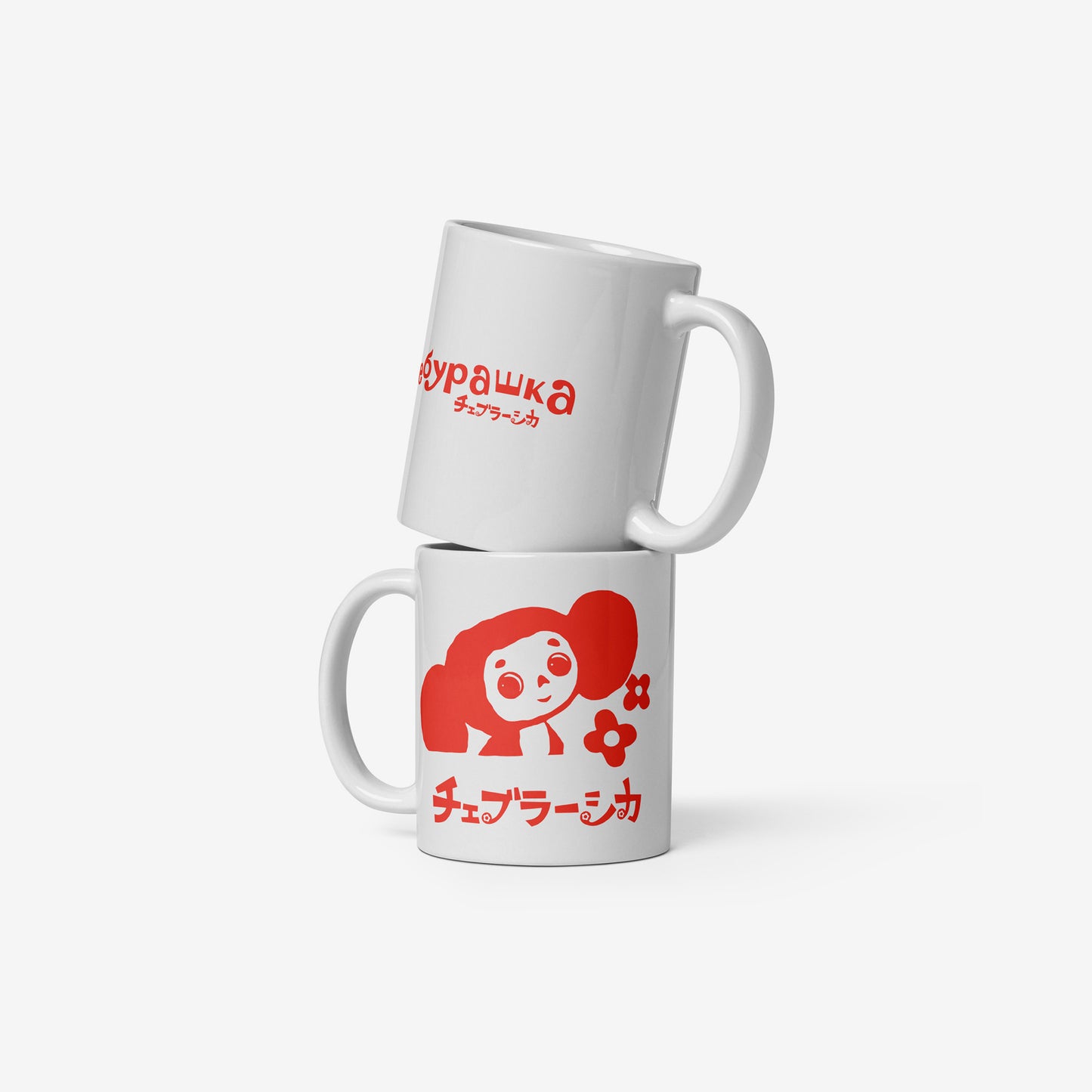 White coffee cup featuring Cheburashka with flowers and チェブラーシカ logo in red. Front and back.