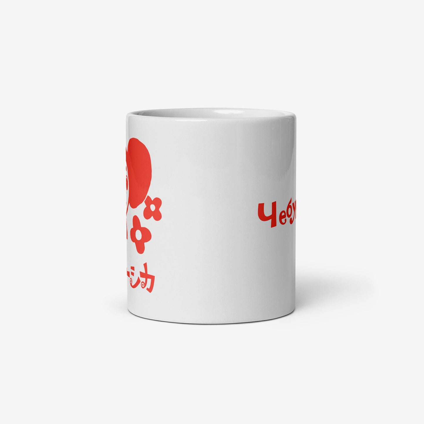 White coffee cup featuring Cheburashka with flowers and チェブラーシカ logo in red. Side.