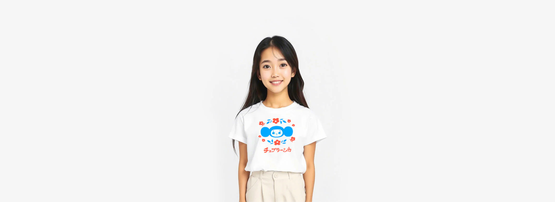 A cute japanese young girl smiling and wearing white unisex T-shirt with Soviet cartoon character Cheburashka among flowers. www.cheburashkashop.com