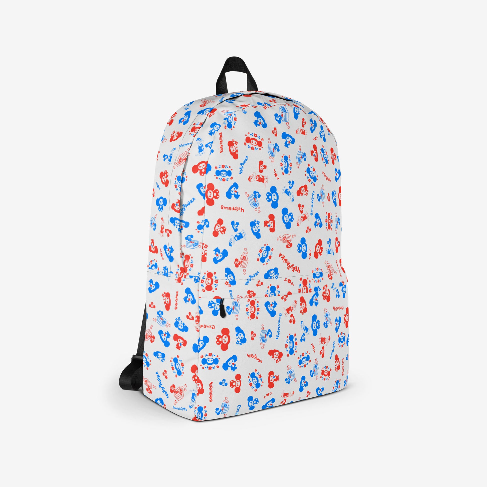 A white backpack with a front pocket, featuring all over print pattern of the Soviet cartoon character Cheburashka in blue and red. Right side photo.