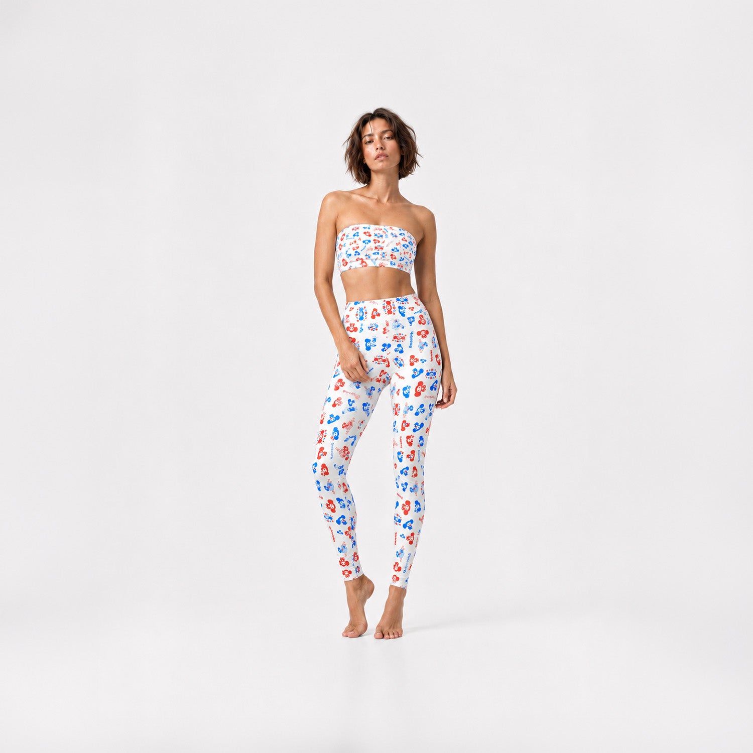 Young fit model girl wearing original Soviet Cheburashka cartoon character overall print white bikini top and yoga leggings. Worldwide shipping.