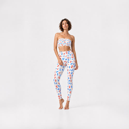 Young fit model girl wearing original Soviet Cheburashka cartoon character overall print white bikini top and yoga leggings. Worldwide shipping.